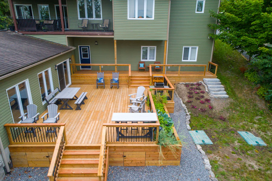 Wooden deck with outdoor furniture beside a house